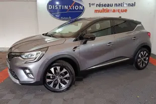 Renault Captur Techno TCe 90 gris foncé en vue latérale droite, avec jantes alliage et feux LED allumés.