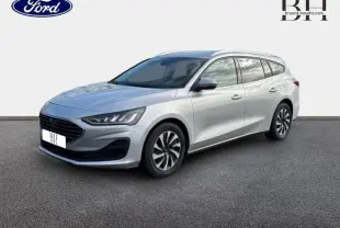 Ford Focus SW gris lunaire métallisé vue 3/4 avant droit avec calandre noire et jantes alliage.