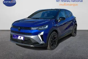 Renault Captur E-Tech hybride bleu Iron Metal avec toit noir, vue 3/4 avant côté gauche sur sol gris.