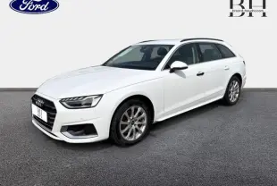 Audi A4 Avant blanc glacier métallisé vue 3/4 avant droit sur fond neutre avec jantes alu visibles.