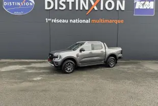 Vue latérale droite du Ford Ranger 2025 gris métallisé Wildtrak, avec benne et jantes alliage noires.