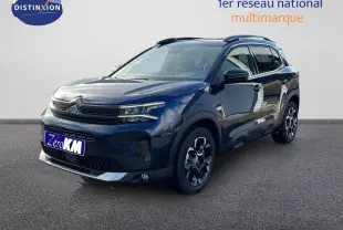 Citroën C5 Aircross bleu Eclipse Metal en 3/4 avant droit avec jantes bi-ton et barres de toit noires.