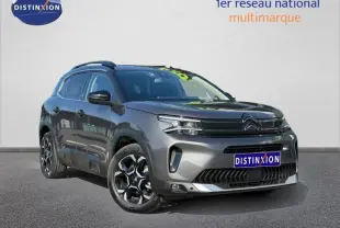Citroën C5 Aircross gris Platinium vue 3/4 avant droit, SUV hybride avec jantes distinctives et calandre moderne.