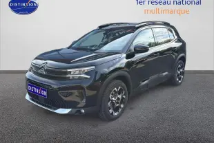 Citroën C5 Aircross noir perla nera vue 3/4 avant droit avec jantes alu et barres de toit visibles.