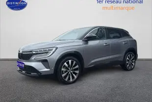 Renault Austral gris schiste en 3/4 avant droit, avec jantes alliage et toit noir contrasté visible.