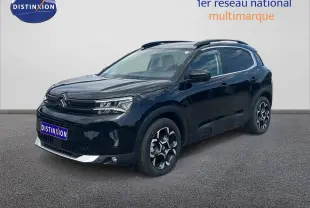 Citroën C5 Aircross 2025 noir métal en 3/4 avant droit, avec jantes distinctives et toit panoramique.