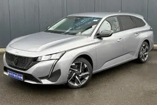 Peugeot 308 SW Hybrid gris Artense vue 3/4 avant droit avec jantes alliage et feux LED diurnes.