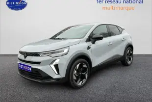 Renault Captur gris rafale en 3/4 avant droit, avec jantes alu noires et détails noirs contrastants.