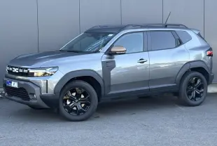 SUV Dacia Duster ECO-G 120 Auto Extrême gris schiste, vue de profil côté gauche avec jantes noires et barres de toit.