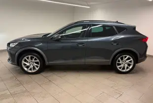 Profil côté gauche du CUPRA Formentor 1.5 TSI gris magnétique 2024, avec jantes alliage et lignes épurées.