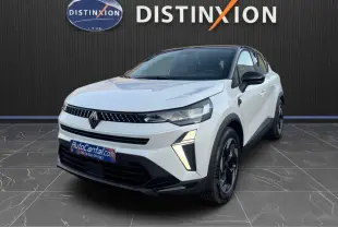 Renault Captur E-Tech blanc nacré toit noir en 3/4 avant droit, avec signature lumineuse LED distinctive.