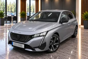 Peugeot 308 gris sellenium vue 3/4 avant droit, avec calandre noire et feux LED verticaux distinctifs.