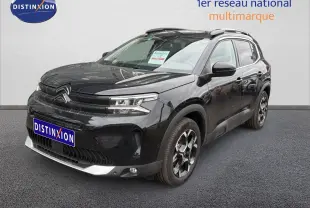 SUV Citroën C5 Aircross noir métal vu en 3/4 avant droit, avec jantes bicolores et calandre moderne.