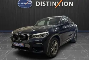 BMW X4 XDrive 20d 190 ch M SPORT en Carbonschwarz, vue 3/4 avant avec calandre et phares LED distinctifs.