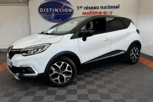 Renault Captur Intens TCe 90 blanc en 3/4 avant droit, avec jantes alliage et détails noirs contrastants.
