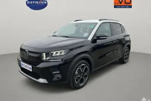 Citroën C3 noir vue 3/4 avant droit, avec toit blanc, barres de toit et jantes alliage 17 pouces.