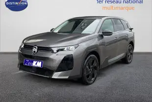 Citroën C5 Aircross Hybrid gris platinium métal en 3/4 avant droit avec jantes noires et calandre distinctive.