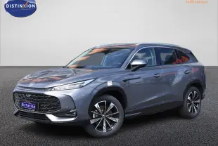MG Motor EHS 1.5 Hybrid+ gris vu en 3/4 avant droit, avec calandre large et jantes alliage distinctives.