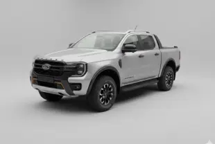 Ford Ranger Wildtrak gris en 3/4 avant droit, avec barres de toit, jantes alliage noires et vitres surteintées.