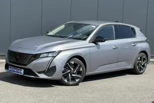Peugeot 308 Hybrid gris Artense vue 3/4 avant droit, jantes alliage 17'' Halong diamantées et vitres surteintées.