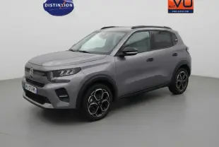 Citroën C3 Turbo 100 ch gris, vue 3/4 avant droit, avec jantes alliage 17 pouces et barres de toit noires.