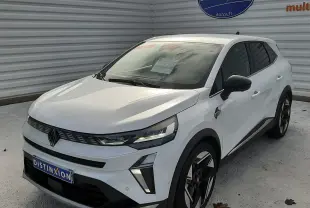 Renault Symbioz blanc nacré en 3/4 avant droit, avec jantes bicolores et détails noirs contrastants.