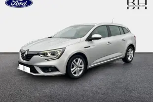 Renault Mégane Break gris platine vue 3/4 avant droit, avec phares LED et jantes alliage cinq branches.