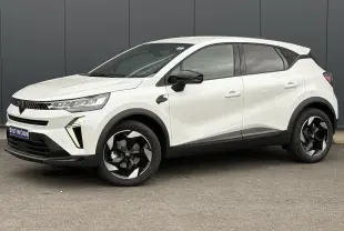 Renault Captur blanc nacré en vue de profil côté gauche, avec jantes noires et détails noirs contrastants.