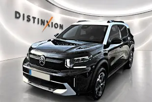 Citroën C3 Aircross noir vue 3/4 avant droit avec toit blanc et jantes alu dans showroom lumineux.