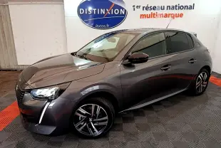 PEUGEOT 208 gris foncé vue 3/4 avant droit, avec jantes alliage et feux LED distinctifs.