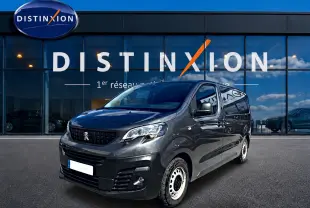 Peugeot Expert Fourgon gris vu en 3/4 avant droit, avec porte latérale coulissante et jantes acier blanches.
