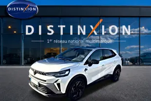 Renault Symbioz blanc nacré en 3/4 avant droit, avec jantes noires et détails noirs contrastants.