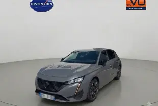 Peugeot 308 Hybrid gris vue 3/4 avant droit, avec jantes alliage 17 pouces et feux LED distinctifs.