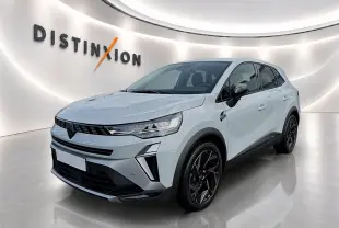 Renault Symbioz 2026 gris rafale en 3/4 avant droit, avec jantes noires et calandre moderne dans un showroom lumineux.